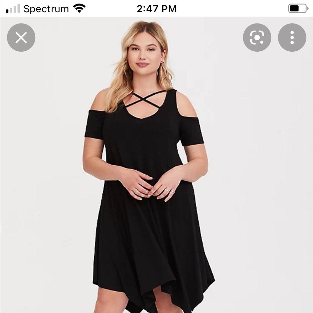 Torrid strappy cold shoulder handerchief hem line.